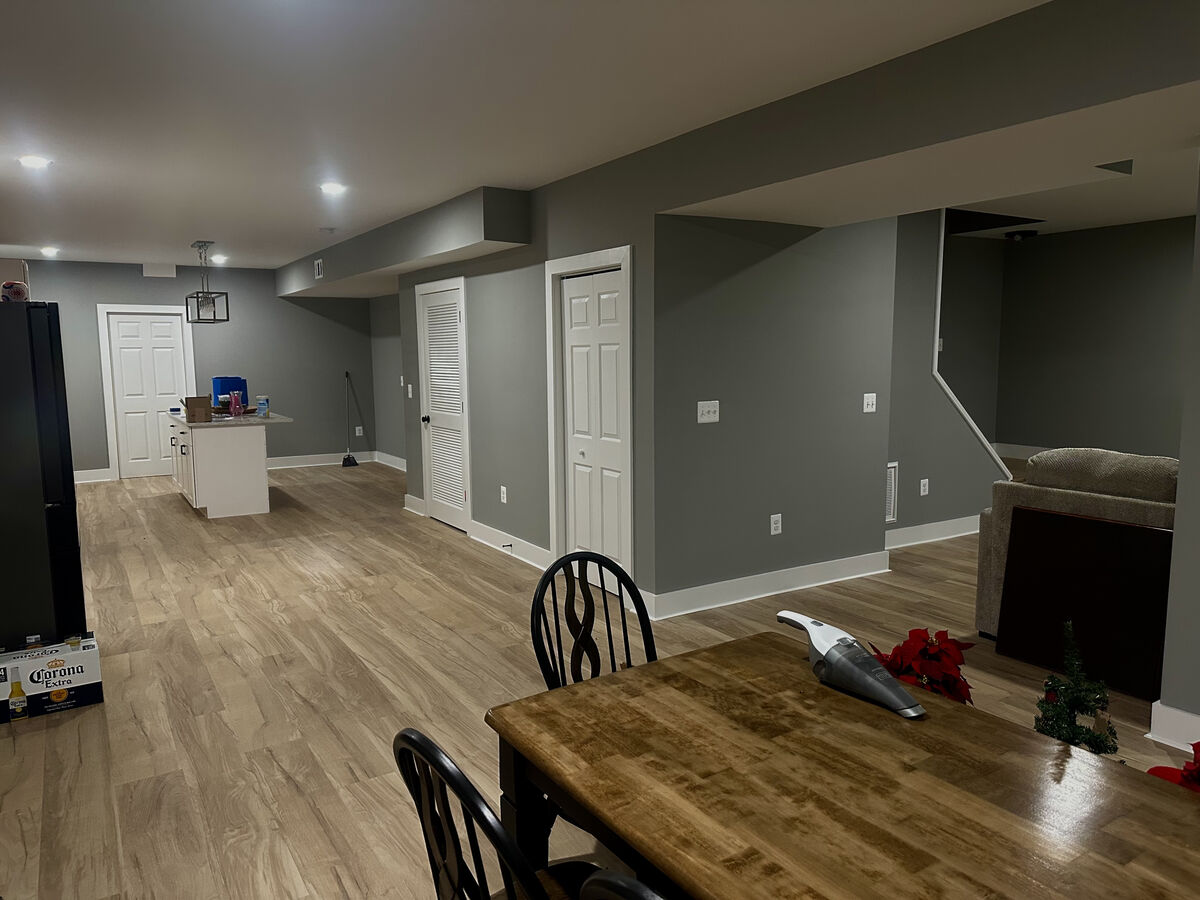 Finished basement living and dining area by MB Builds