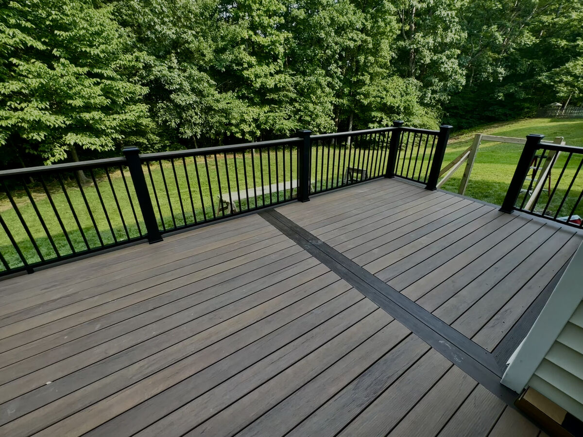 Finished composite deck with black railing